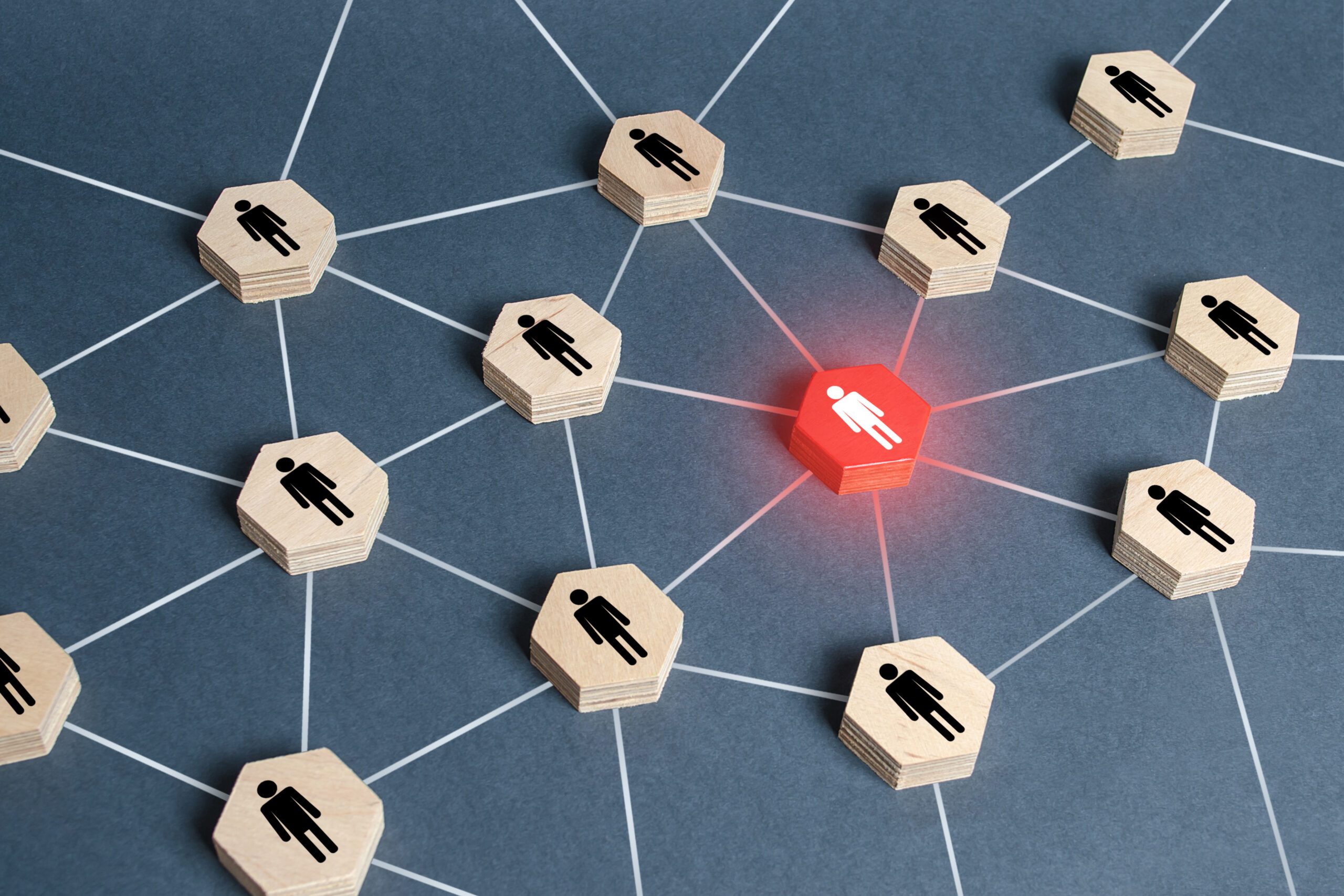 Red human figure in a network. Leader and leadership skills. Teamwork of a talented professional worker. Weak link, toxic worker. Security threat. Cooperation, collaboration. Spy. Employee replacement Red human figure in a network. Leader and leadership skills. Teamwork of a talented professional worker. Weak link, toxic worker. Security threat. Cooperation, collaboration. Spy. Employee replacement